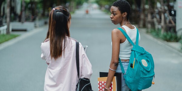 two students walk together