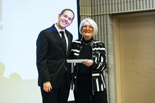 Corey Grunberg and Professor Molly Verrier standing together.