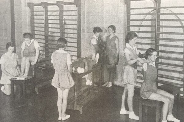 Black & White image of women practising PT