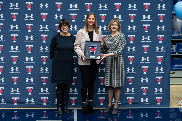 Katie Humhej poses with award with Sandy Welsh and Gretchen Kerr