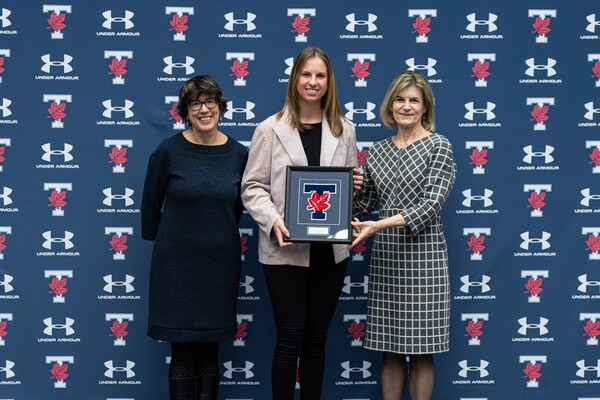 Katie Humhej poses with Ontario Top Scholar Athlete award with Sandy Welsh and Gretchen Kerr