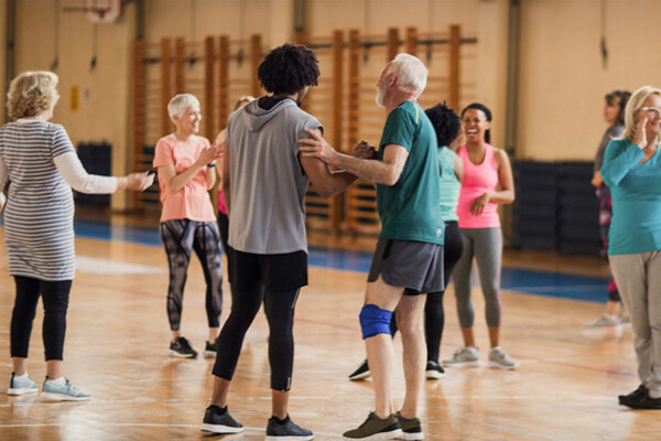 Group of adults participate in exercise class