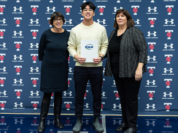 Kinsley Wu poses with award with Sandy Welsh and Beth Ali