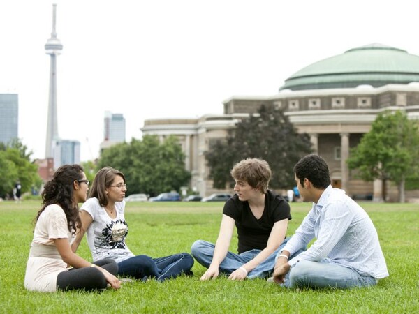Students sitting on grass talking