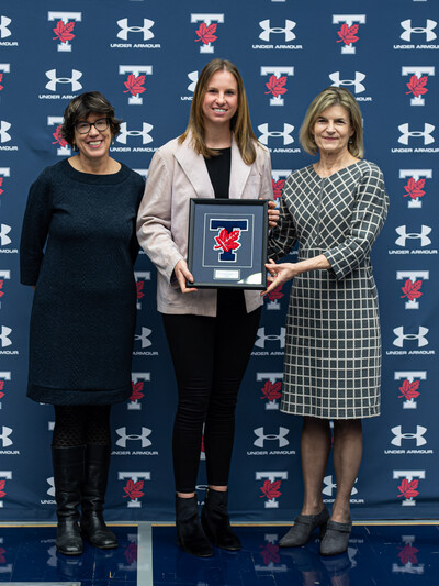 Katie Humhej poses with award with Sandy Welsh and Gretchen Kerr